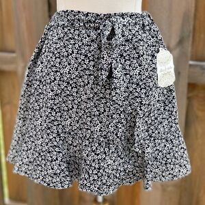Altar’d State Black & White Floral Mini Skirt – Ruffle Hem and Tie Waist. Size L